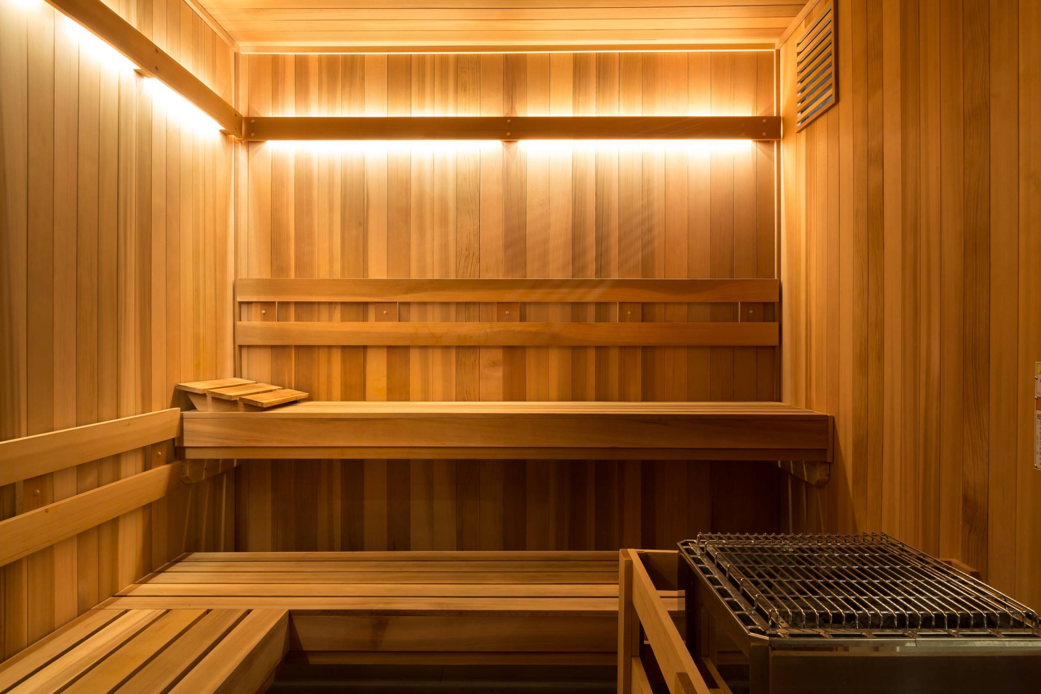 Apartments at holly crest luxury sauna amenity with wood paneling and led lighting