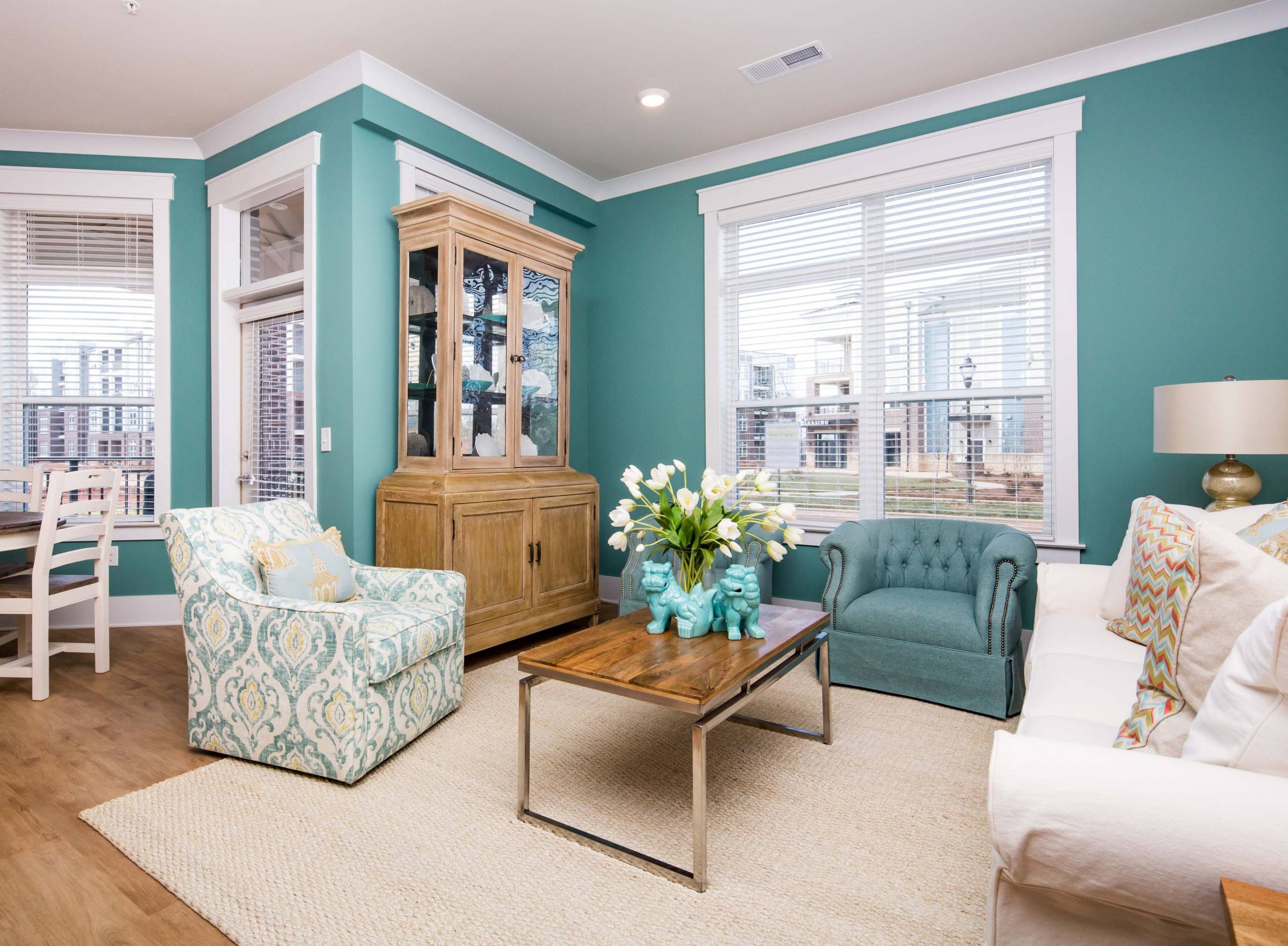 Apartments at holly crest luxury apartment interior with seating and aqua green accent wall