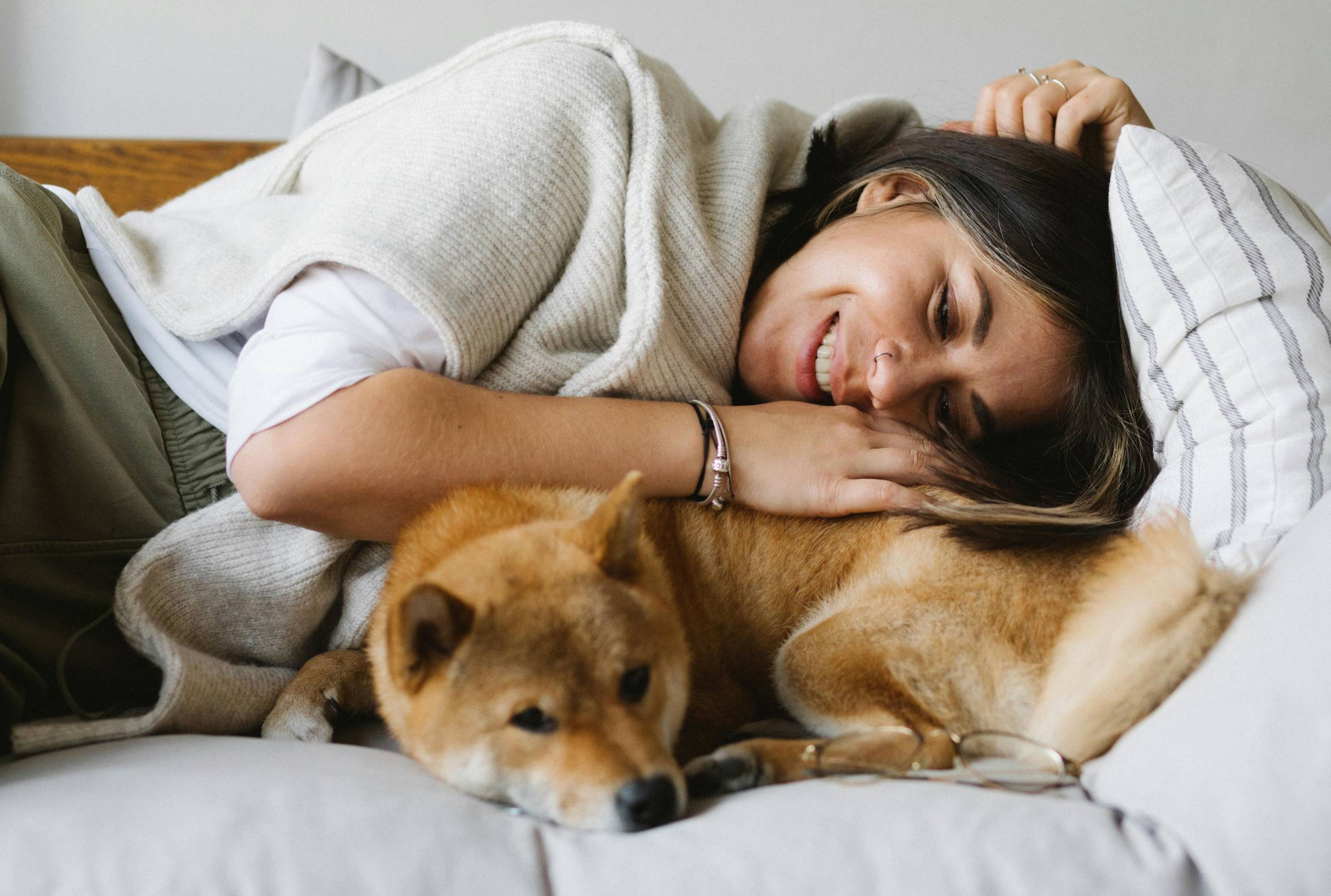 Apartments at holly crest pet friendly apartments woman laying with her dog